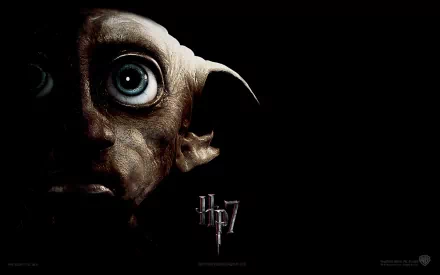 HD wallpaper featuring Dobby from Harry Potter and the Deathly Hallows: Part 1, highlighting his prominent features against a dark background.
