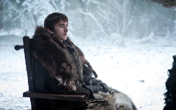 Isaac Hempstead-Wright as Bran Stark from the TV show Game of Thrones, seated outdoors in a snowy landscape, presented as a 4K Ultra HD PC desktop wallpaper.