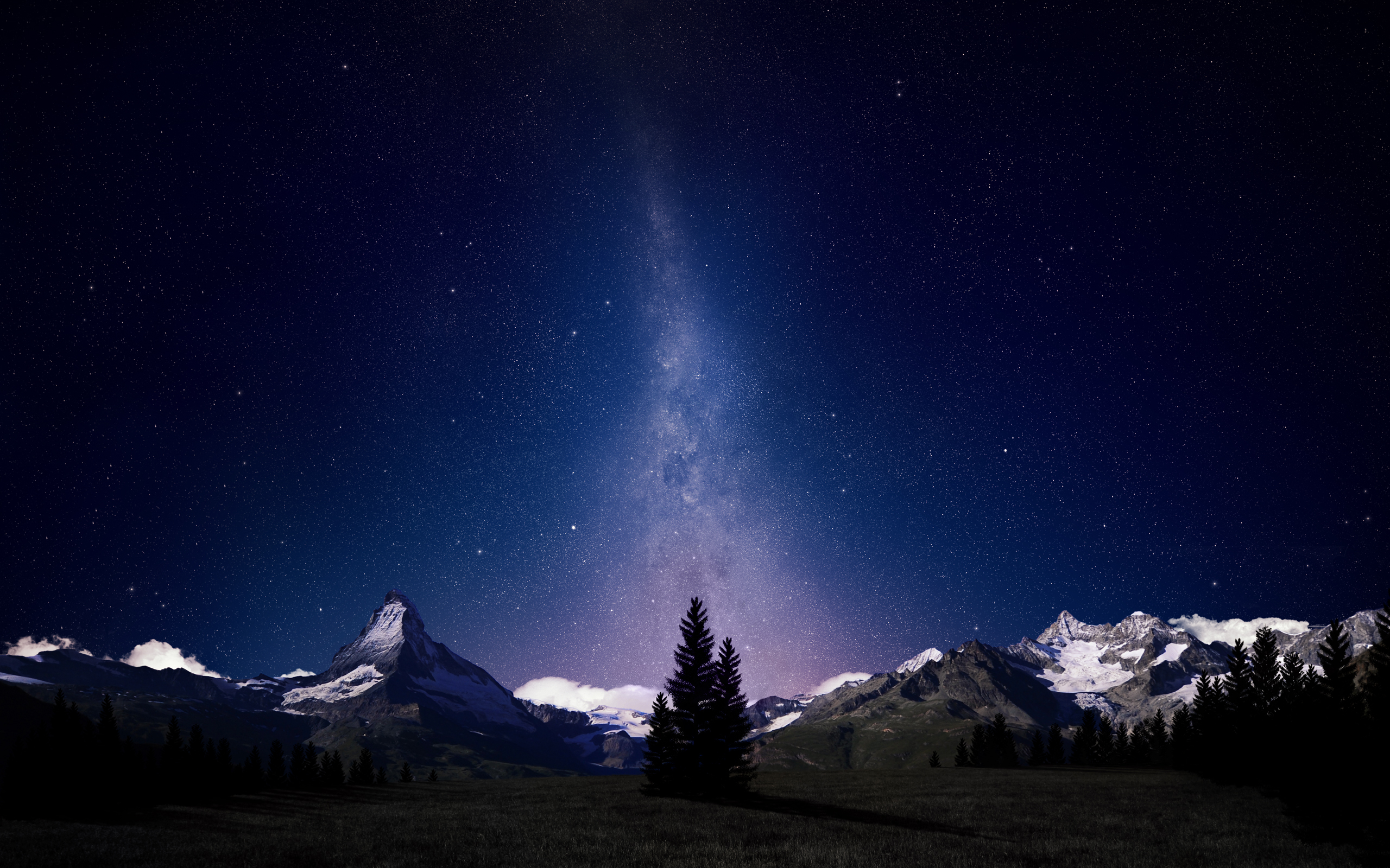 Alpine Night Sky: Majestic mountain under a starry night sky.