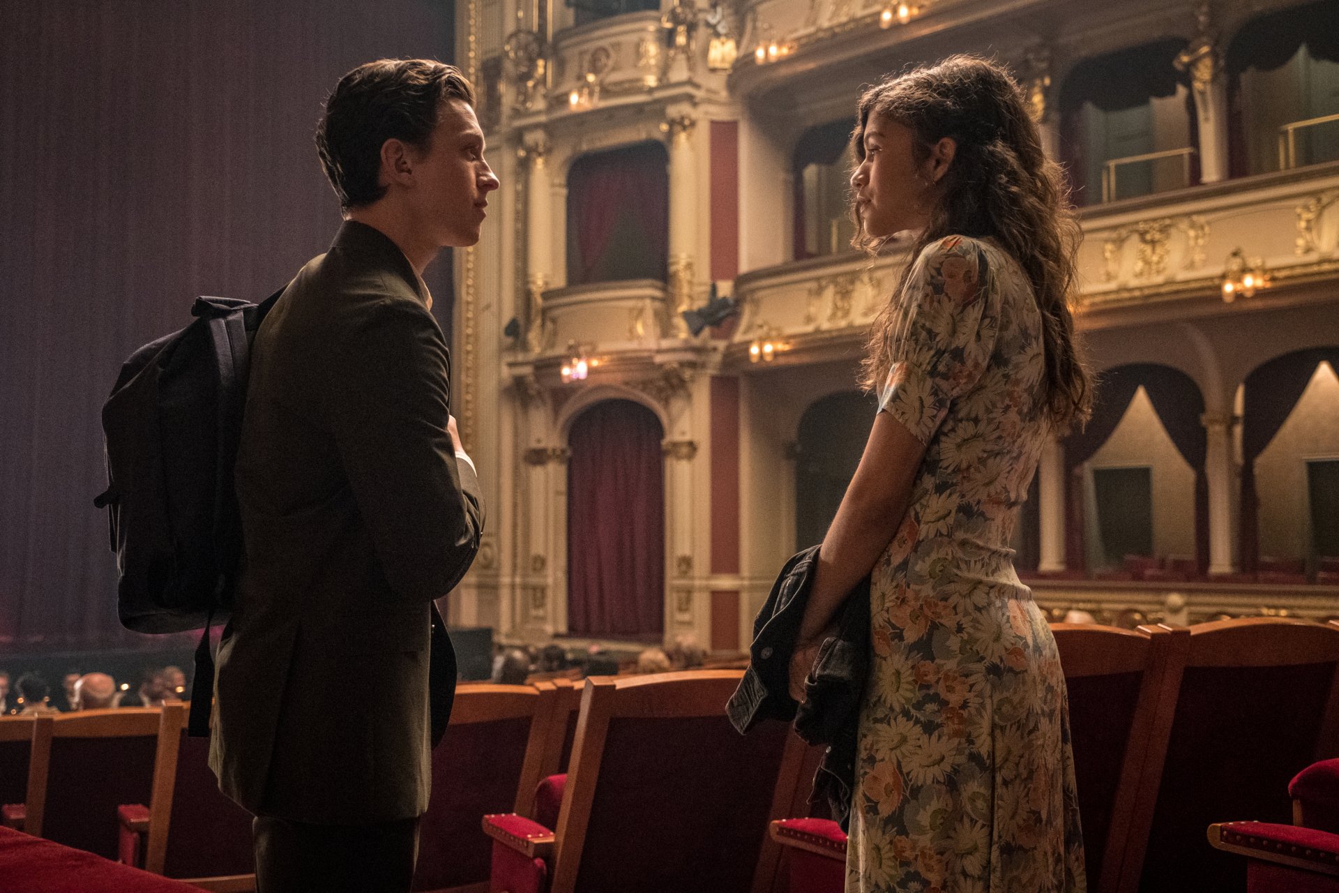 4K Ultra HD wallpaper featuring Tom Holland as Spider-Man and Zendaya as MJ in a scene from Spider-Man: Far From Home, set inside an ornate theater.