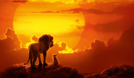 HD wallpaper featuring Mufasa and baby Simba from The Lion King (2019) movie. The two lions stand on a rock, gazing at a stunning sunset.