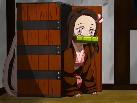 HD desktop wallpaper featuring Nezuko Kamado from the anime Demon Slayer: Kimetsu no Yaiba, showing her peeking out from behind a wooden box with a bamboo muzzle in her mouth.