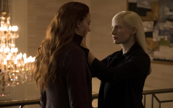 4K Ultra HD wallpaper featuring Sophie Turner as Jean Grey and Jessica Chastain from the X-Men movie Dark Phoenix in a dramatic, dimly lit scene.