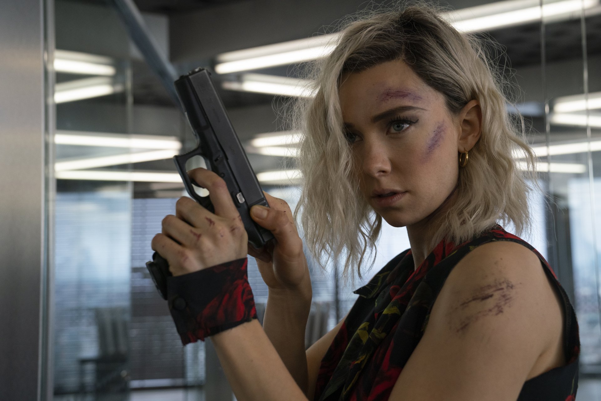 Hattie Shaw, played by Vanessa Kirby in Fast & Furious Presents: Hobbs & Shaw, holds a gun in a tense 8K Ultra HD movie scene.