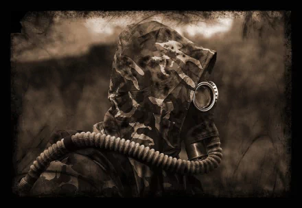 HD military-themed desktop wallpaper showing a soldier wearing a gas mask and camouflage gear in a dark, smoky environment.
