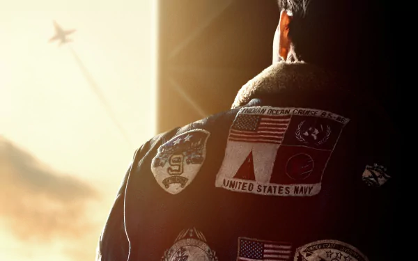 4K Ultra HD PC desktop wallpaper featuring a scene from the movie Top Gun: Maverick, showing a pilot with patches on his jacket and a jet flying in the distance.