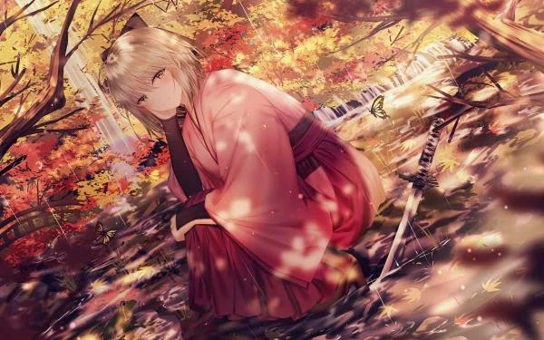 HD desktop wallpaper featuring the anime character Okita Sōji, also known as Sakura Saber from Fate/Grand Order, kneeling in a serene autumn forest with vibrant fall leaves and a sword beside her.