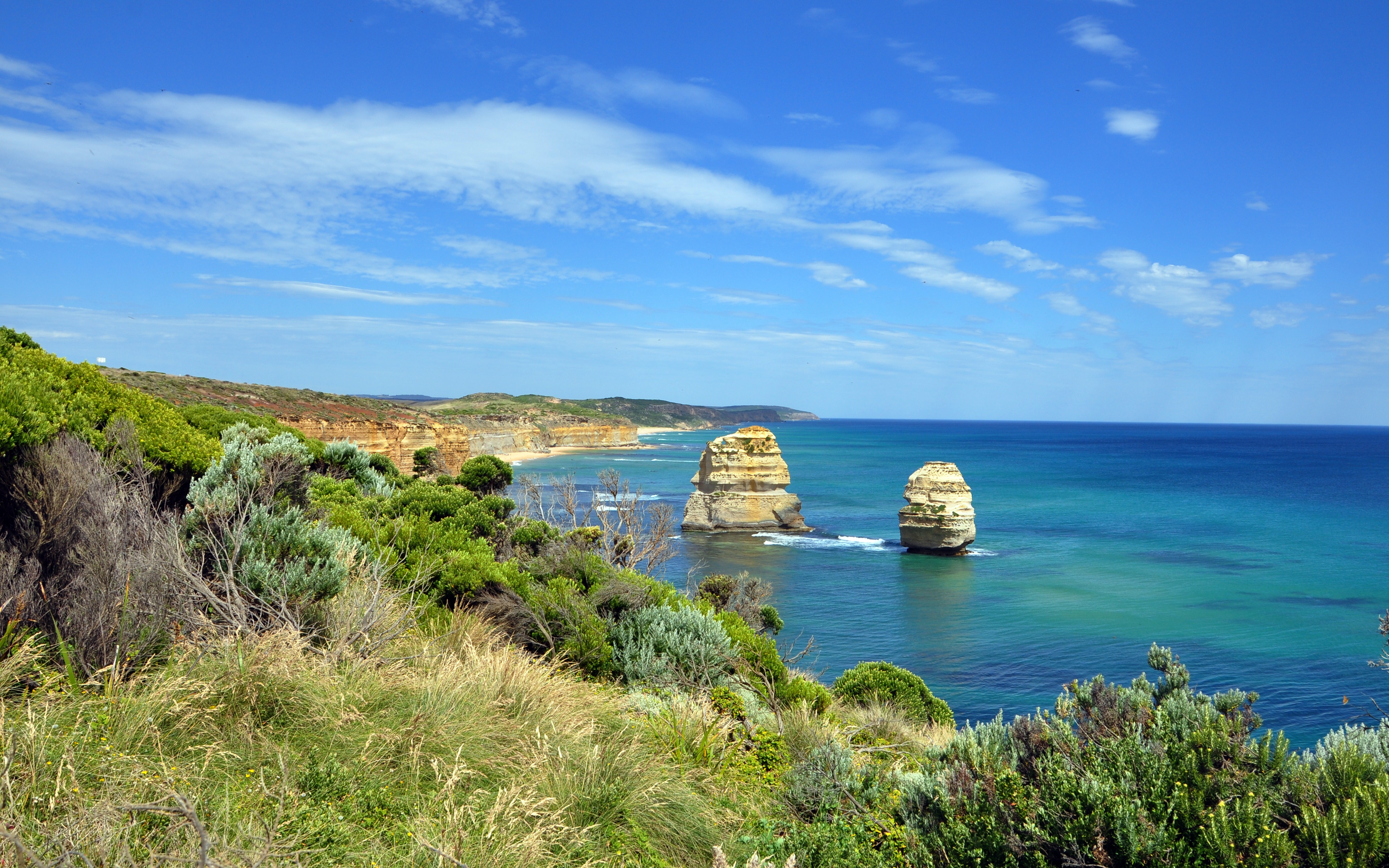 The Twelve Apostles - Spectacular coastline in Australia with blue sky and clouds.