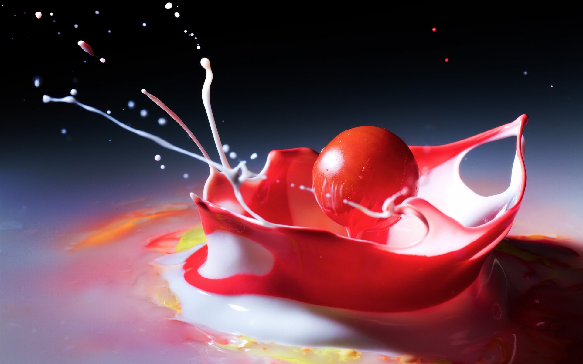 HD photography of a vivid red splash frozen in motion against a dark gradient background, creating a striking, cool PC desktop wallpaper.