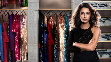 Brunette English actress Naomi Scott from Charlie's Angels (2019) stands confidently in front of a colorful sequined wardrobe in this 4K Ultra HD desktop wallpaper.