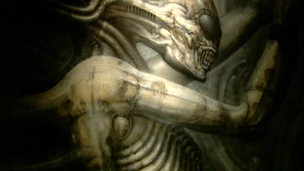 HD PC desktop wallpaper and background featuring a movie alien: a biomechanical creature with elongated skull, exposed ribs and menacing jaws in moody, sepia-toned lighting.