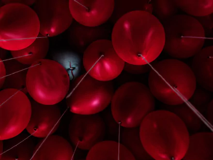 HD PC desktop wallpaper of clustered red balloons with a shadowy Pennywise from the movie It Chapter Two.