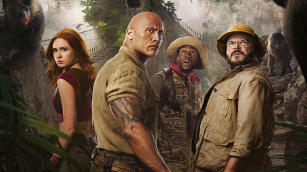 2K Quad HD movie wallpaper: four characters from Jumanji: The Next Level in a jungle — a muscular man, a small soldier in camo, a bespectacled explorer, and a red‑haired woman.
