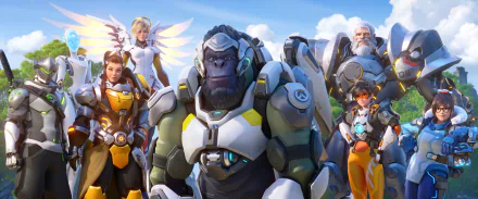 2K Quad HD PC wallpaper of Overwatch 2: Winston center with Reinhardt, Mercy, Tracer, Mei, Brigitte and Genji behind in a bright video game hero lineup.