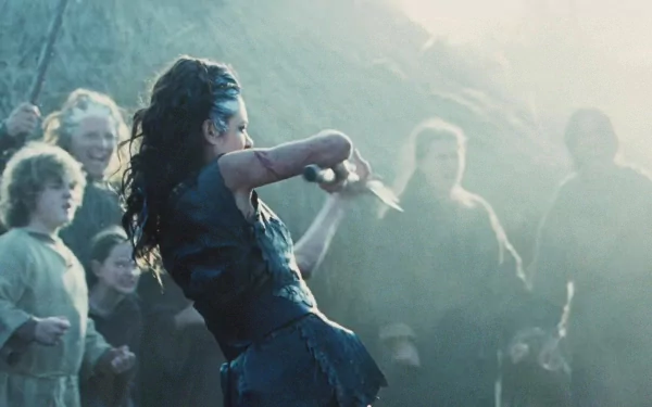 Brigantian warrior from the movie Centurion lunging with a dagger amid a misty crowd — HD PC desktop wallpaper and background