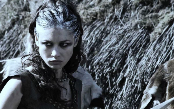 HD desktop wallpaper featuring a fierce Brigantian warrior from the movie Centurion, captured with intense expression and rugged natural background.