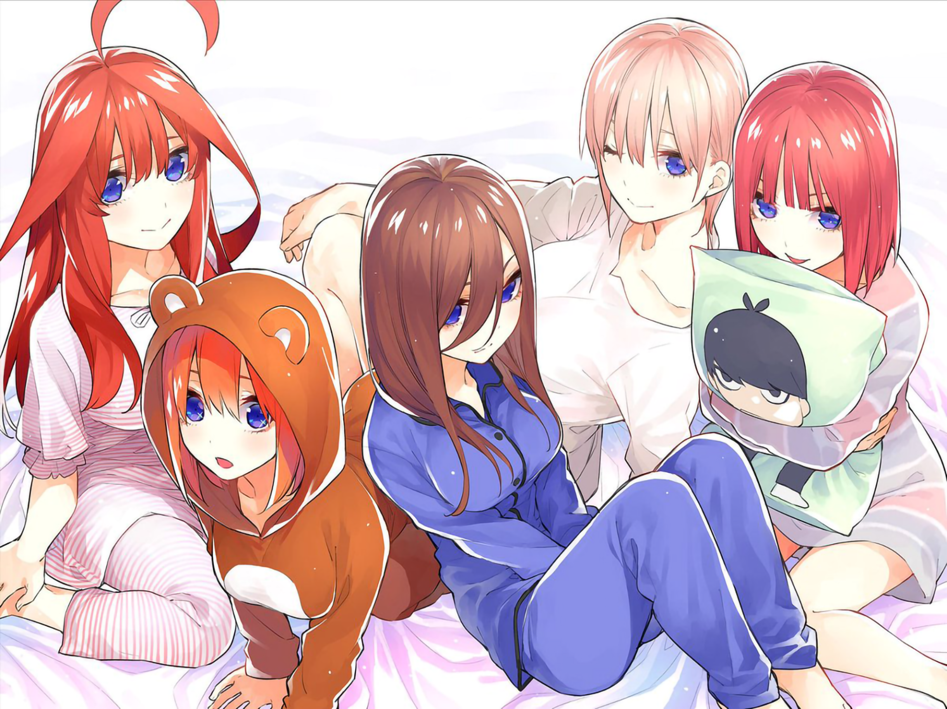 HD wallpaper featuring Itsuki Nakano, Yotsuba Nakano, Miku Nakano, Nino Nakano, and Ichika Nakano from the anime The Quintessential Quintuplets, all sitting together on a bed in casual and cute outfits.