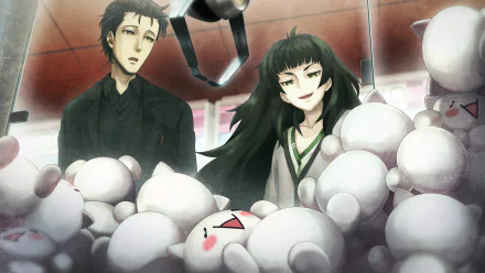 HD PC wallpaper of Maho Hiyajo and Rintaro Okabe from Steins;Gate 0, anime-style, standing amid plush toys inside an arcade claw machine — a vivid desktop background.