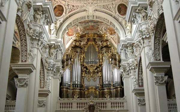 HD desktop wallpaper showcasing the intricate organ and ornate interior of St. Stephen's Cathedral, highlighting its religious and architectural grandeur.