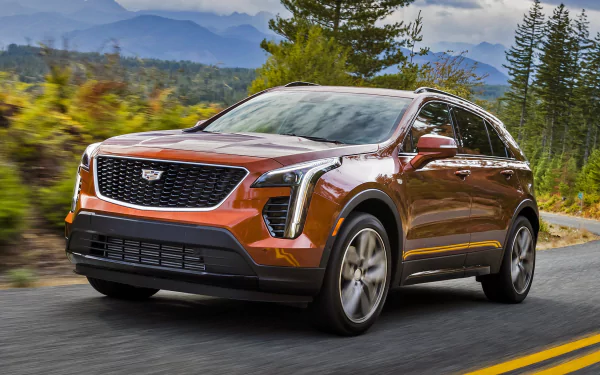 orange car SUV car Cadillac vehicle Cadillac XT4 HD Desktop Wallpaper | Background Image