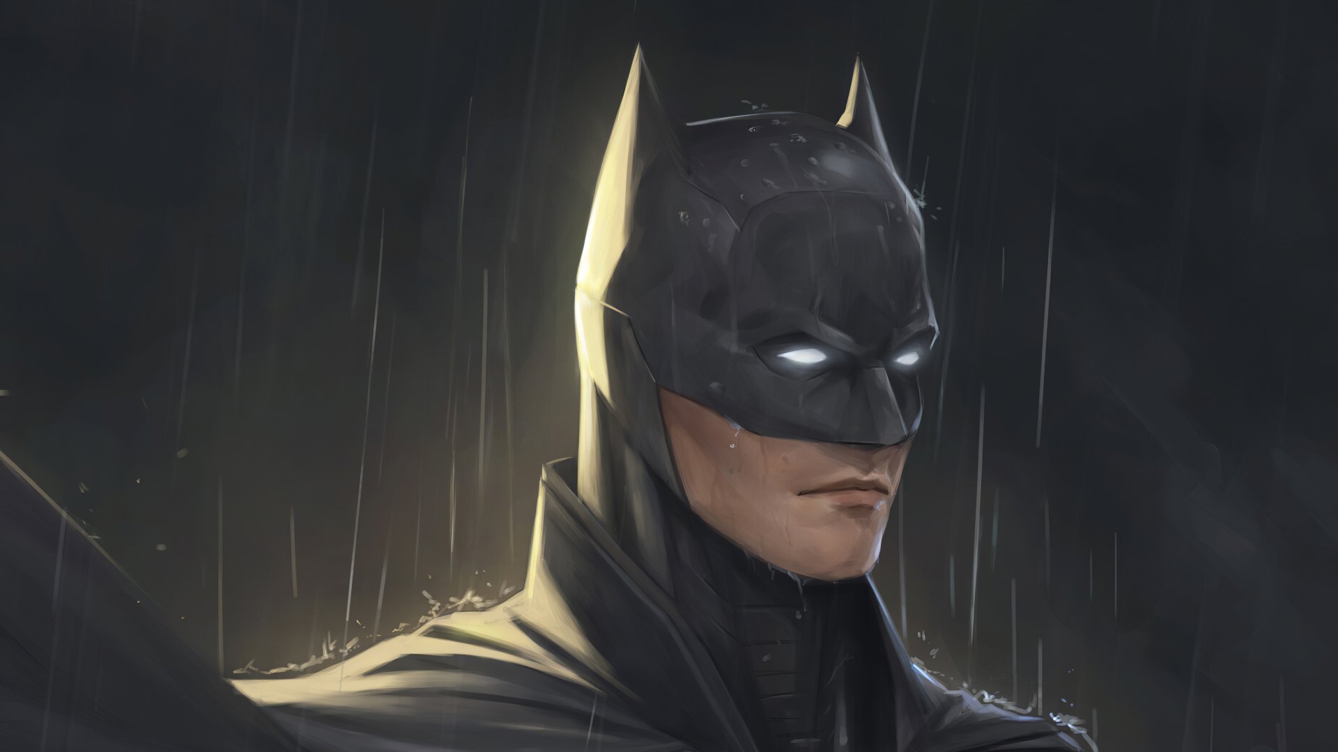 HD PC desktop wallpaper featuring a close-up of Batman from DC Comics, showcasing his iconic cowl and intense gaze in a dark, rainy atmosphere.