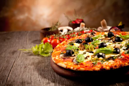 HD wallpaper of a vibrant pizza still life, featuring a freshly made pizza with olives, herbs, and vegetables on a rustic wooden table.