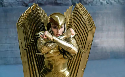 HD PC wallpaper featuring Gal Gadot as Diana Prince in golden armor with large wings from the DC Comics movie Wonder Woman 1984.