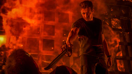 Video game — Uncharted 4: A Thief's End 4K Ultra HD PC desktop wallpaper: protagonist in a fiery room, backlit by orange flames, wielding a large knife over a fallen foe.