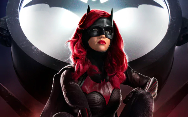 Kate Kane’s Batwoman in red hair, black suit and mask before a large bat emblem — 4K Ultra HD PC desktop wallpaper/background from the TV show.