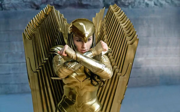 HD PC wallpaper featuring Gal Gadot as Diana Prince in golden armor with large wings from the DC Comics movie Wonder Woman 1984.