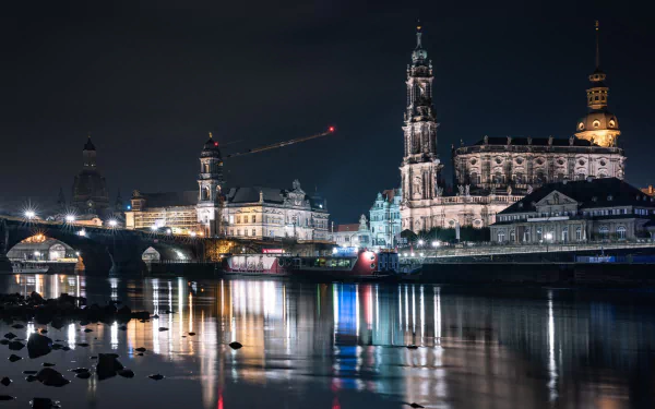Nighttime view of illuminated man-made architecture along the river in Dresden, captured in stunning 4K Ultra HD for a PC desktop wallpaper.