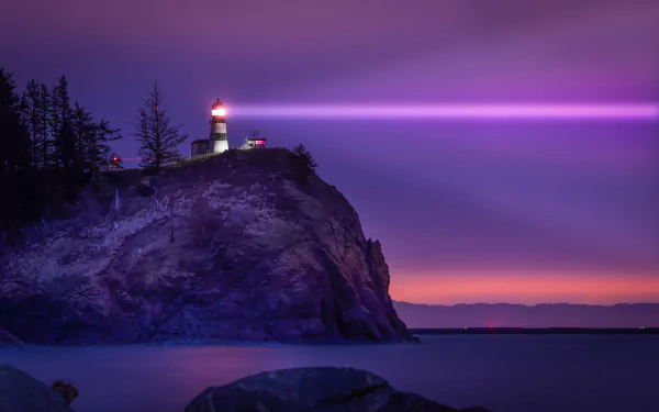 An 8K Ultra HD night scene of a man-made lighthouse on a rocky cliff, casting a vibrant purple beam over calm waters and silhouetted trees.
