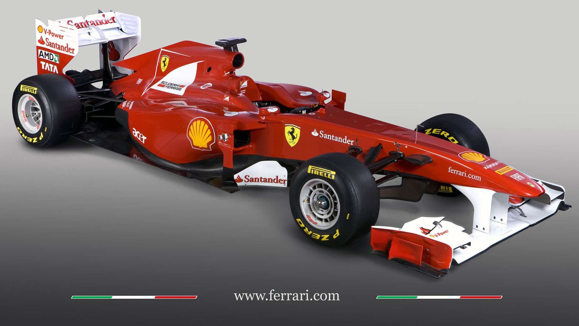 HD PC desktop wallpaper featuring a red Ferrari F1 racing car on a plain gray background, emphasizing speed and design in Formula 1 sports.