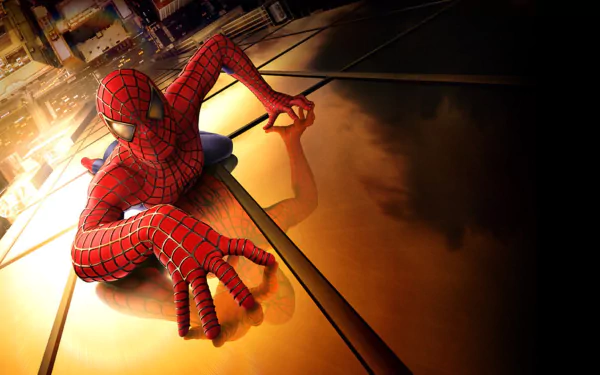 HD PC desktop wallpaper featuring Tobey Maguire as Spider-Man, portraying Peter Parker in a dynamic pose on a building rooftop from the Spider-Man movie.