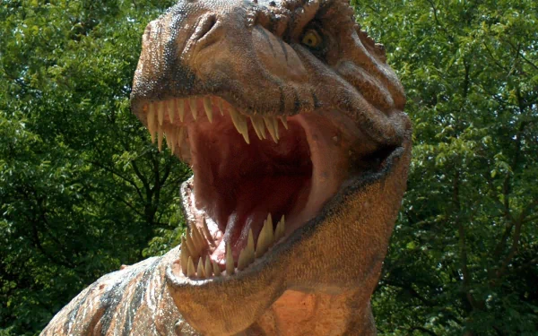 A high-definition desktop wallpaper featuring a roaring Tyrannosaurus Rex against a backdrop of lush greenery.