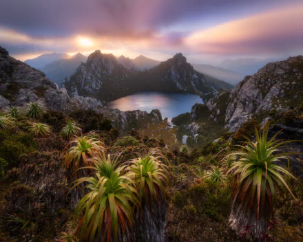 Sunrise over Lake Oberon in the Western Arthurs, Tasmania, Australia, showcasing rugged mountains, lush vegetation, and a serene lake in this stunning HD landscape wallpaper.