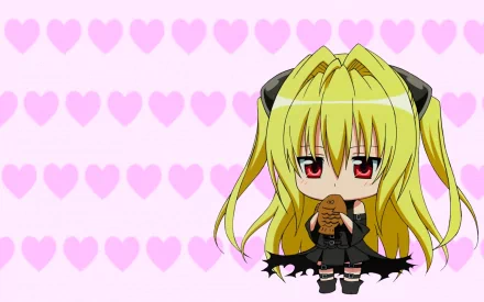 Chibi Golden Darkness from the anime To Love-Ru stands against a soft pink heart background, holding a small creature, creating a charming and whimsical wallpaper.