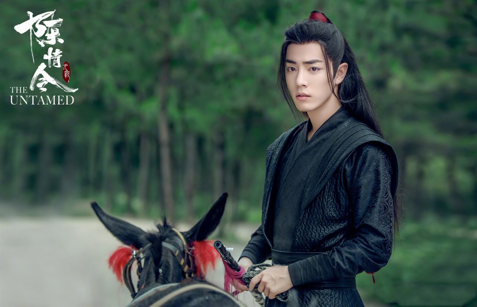 HD PC desktop wallpaper: lone man in black hanfu on horseback against a forest backdrop, promotional image for the TV show The Untamed.