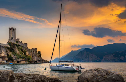 yacht lake mountain sunset fortress alps Italy lake garda man made castle HD Desktop Wallpaper | Background Image