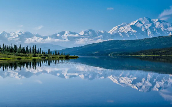 Denali National Park, Alaska — snowcapped mountains and their reflection in a glassy lake, tree-lined shore under a clear blue sky; HD PC desktop wallpaper, nature background.