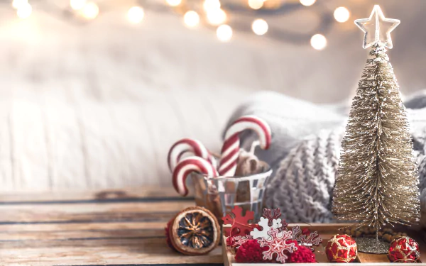 4K Ultra HD desktop wallpaper featuring festive candy canes, Christmas ornaments, and a shimmering holiday tree against a cozy, softly lit background.