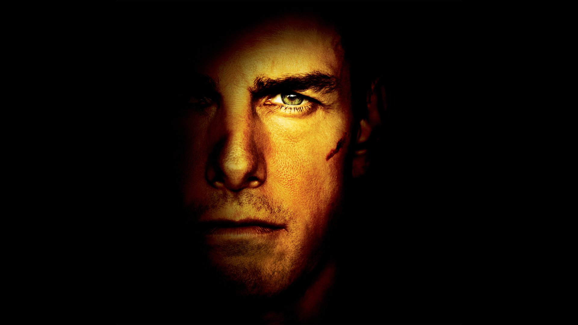 Close-up of Tom Cruise as Jack Reacher with intense expression, rendered in 8K Ultra HD for a dramatic movie-themed PC desktop wallpaper.