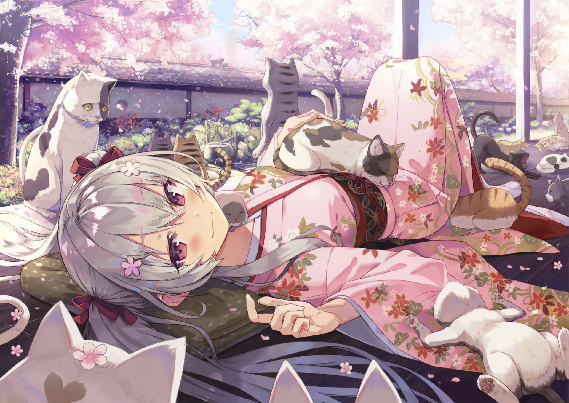 An anime girl with white hair and red eyes lies among cats, wearing a floral pink kimono under blooming cherry blossoms in a serene Japanese garden setting.