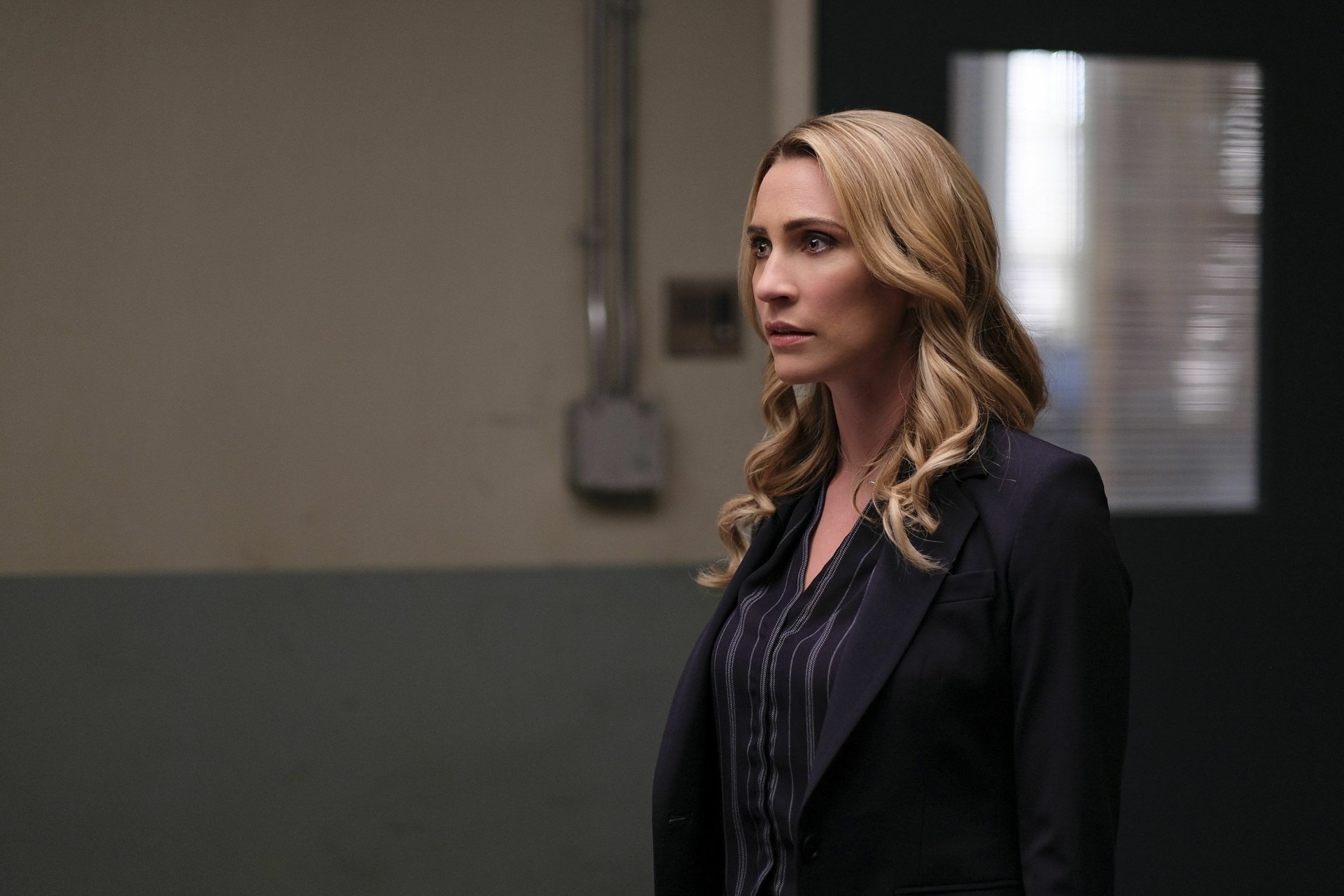 HD desktop wallpaper featuring a woman in a professional suit against an indoor background, tagged with Jessica Harmon.