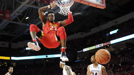 HD desktop wallpaper featuring Bruno Fernando mid-dunk in a basketball game, with the ball bouncing off the rim.