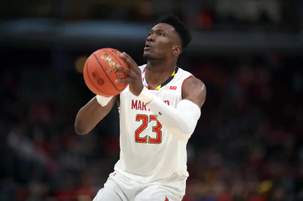 HD desktop wallpaper of basketball player in action on the court, wearing a white jersey with number 23, tagged with Bruno Fernando.