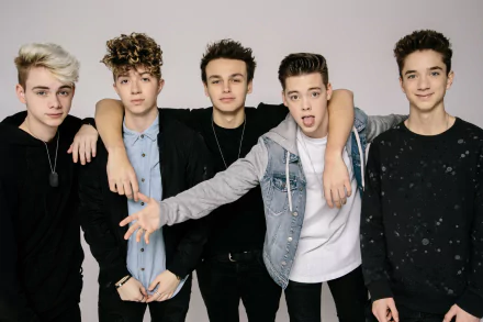 HD desktop wallpaper featuring the members of the band Why Don't We posing together for a group photo.