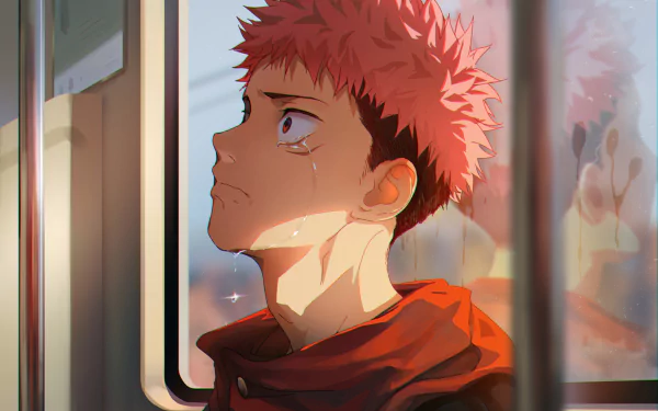 HD desktop wallpaper of Yuji Itadori from Jujutsu Kaisen, with pink hair and tears, looking out a train window.