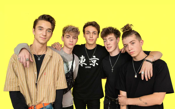 HD desktop wallpaper featuring the band Why Don't We, with members posing against a bright yellow background.