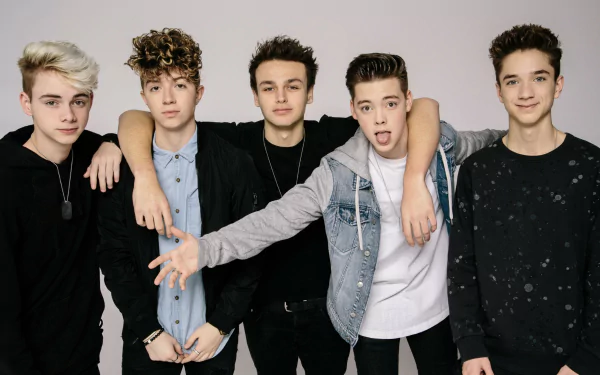 HD desktop wallpaper featuring the members of the band Why Don't We posing together for a group photo.